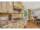 Updated kitchen featuring granite counters, modern cooktop, and ample cabinetry at 186 Ashley Dr, Mcdonough, GA 30252