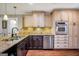 Kitchen features stainless steel appliances, granite counters, and ample storage at 186 Ashley Dr, Mcdonough, GA 30252