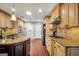 Spacious kitchen boasts granite countertops, gas range, and ample storage space at 186 Ashley Dr, Mcdonough, GA 30252