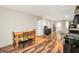 Eat-in kitchen featuring laminate flooring, modern appliances, and dining table at 186 Ashley Dr, Mcdonough, GA 30252