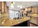 Modern kitchen featuring granite countertops, custom cabinets, and stainless sink at 186 Ashley Dr, Mcdonough, GA 30252