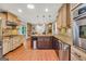 Bright kitchen featuring granite countertops, a kitchen island, and stainless appliances at 186 Ashley Dr, Mcdonough, GA 30252