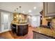 Well-equipped kitchen features granite counters, island with seating, and ample cabinets at 186 Ashley Dr, Mcdonough, GA 30252