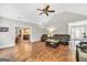 Spacious living room featuring hardwood floors and modern ceiling fan fixture at 186 Ashley Dr, Mcdonough, GA 30252