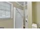 Clean, tiled shower stall with a glass door and a window for natural light at 3034 Brookgreen Trl, Lawrenceville, GA 30043