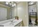 Bright bathroom with a white vanity and a doorway leading to a toilet and shower area at 3034 Brookgreen Trl, Lawrenceville, GA 30043