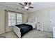 Cozy bedroom with a window, ceiling fan, and neutral decor at 3034 Brookgreen Trl, Lawrenceville, GA 30043