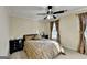 Comfortable bedroom with a bed, dark furniture, and natural lighting at 3034 Brookgreen Trl, Lawrenceville, GA 30043