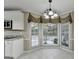 Bright breakfast nook with large windows, providing natural light and backyard views at 3034 Brookgreen Trl, Lawrenceville, GA 30043