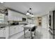 Spacious kitchen with white cabinets, granite countertops, stainless steel appliances, and tile flooring at 3034 Brookgreen Trl, Lawrenceville, GA 30043