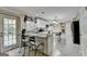 Modern kitchen featuring granite countertops, white cabinetry, stainless steel appliances, and an island with seating at 3034 Brookgreen Trl, Lawrenceville, GA 30043