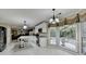 Bright eat-in kitchen with white cabinetry, stainless steel appliances, and large windows offering ample natural light at 3034 Brookgreen Trl, Lawrenceville, GA 30043