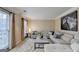 Bright living room featuring a comfortable sectional sofa, neutral decor, and natural light at 3034 Brookgreen Trl, Lawrenceville, GA 30043
