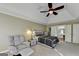 Large primary bedroom with vaulted ceiling and a seating area, plus a doorway leading to the ensuite bath at 3034 Brookgreen Trl, Lawrenceville, GA 30043