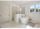 A stunning bathroom featuring a soaking tub, a glass shower, and beautiful tile floors at 5187 Lower Fayetteville Rd, Sharpsburg, GA 30277