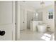 A stunning bathroom featuring a soaking tub, a glass shower, and beautiful tile floors at 5187 Lower Fayetteville Rd, Sharpsburg, GA 30277