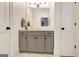 Bathroom features a vanity with grey cabinets and brushed metal hardware at 5187 Lower Fayetteville Rd, Sharpsburg, GA 30277