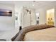 Large bedroom boasts a TV, a hallway with window, and a full bathroom at 5187 Lower Fayetteville Rd, Sharpsburg, GA 30277