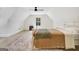 Bright bedroom with an area rug, wood-look floors, and a charming window letting in natural light at 5187 Lower Fayetteville Rd, Sharpsburg, GA 30277