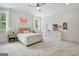 Spacious bedroom with plush carpet, a ceiling fan, and bright windows at 5187 Lower Fayetteville Rd, Sharpsburg, GA 30277