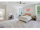 Bright bedroom featuring a vanity, ceiling fan, and plush carpet at 5187 Lower Fayetteville Rd, Sharpsburg, GA 30277