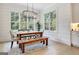Charming dining room with natural light and a rustic table perfect for gatherings at 5187 Lower Fayetteville Rd, Sharpsburg, GA 30277
