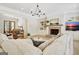 Inviting living room features a cozy fireplace, built-in shelves, and an open floor plan at 5187 Lower Fayetteville Rd, Sharpsburg, GA 30277