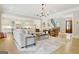 Bright living room boasts hardwood floors and an open layout that connects to the kitchen at 5187 Lower Fayetteville Rd, Sharpsburg, GA 30277