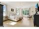 Spacious main bedroom with hardwood floors, neutral tones, and ample natural light creates a serene retreat at 5187 Lower Fayetteville Rd, Sharpsburg, GA 30277