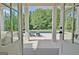 The covered patio showcases views of a private pool and backyard oasis at 5187 Lower Fayetteville Rd, Sharpsburg, GA 30277