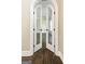 Arched double doors with textured glass leading to a room with hardwood floors at 324 Chimney Sweep Cir, Peachtree City, GA 30269