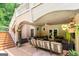 Spacious covered patio features a seating area and staircase leading to an upper level at 709 Prestige Pt, Peachtree City, GA 30269