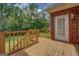 View of the wood back deck overlooking the backyard and wooded area at 1041 Flat Rock Rd, Covington, GA 30014