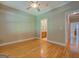 Bedroom with hardwood floors, light-colored walls, and ceiling fan at 1041 Flat Rock Rd, Covington, GA 30014