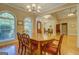 Open concept dining area featuring hardwood floors and an elegant chandelier at 1041 Flat Rock Rd, Covington, GA 30014