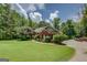 Inviting front exterior of a brick home with well-kept lawn and landscaping, and a paved driveway at 1041 Flat Rock Rd, Covington, GA 30014