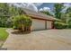 Detached two-car garage with a large driveway, offering ample parking space at 1041 Flat Rock Rd, Covington, GA 30014