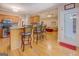 Open kitchen featuring bar seating, wood cabinets and an open view to the living room at 1041 Flat Rock Rd, Covington, GA 30014