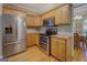Kitchen featuring wood cabinets and stainless steel appliances at 1041 Flat Rock Rd, Covington, GA 30014