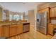 Kitchen with an open design, stainless steel appliances, granite counter tops and wood cabinets at 1041 Flat Rock Rd, Covington, GA 30014