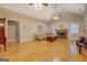 Open-concept living room with hardwood floors, fireplace, and neutral wall color at 1041 Flat Rock Rd, Covington, GA 30014