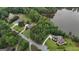 Aerial view of a scenic residential street surrounded by mature trees and green lawns at 81 Smokerise Pt, Peachtree City, GA 30269