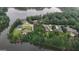 Aerial view of a lakeside community showcasing beautiful homes with lush greenery surrounding the property at 81 Smokerise Pt, Peachtree City, GA 30269