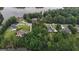 Aerial view of a residential area with mature trees and access to lake views at 81 Smokerise Pt, Peachtree City, GA 30269