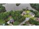 Aerial view of a luxurious lakeside community surrounded by lush trees and serene lake waters at 81 Smokerise Pt, Peachtree City, GA 30269