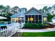 Tranquil backyard featuring a fenced pool area, screened porch and outdoor dining space at 7003 Tara Dr, Villa Rica, GA 30180