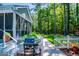 Outdoor grill and pathway lead to a peaceful backyard oasis with room to roam at 7003 Tara Dr, Villa Rica, GA 30180