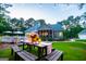 Picturesque backyard with string lights, picnic table, and ample space for outdoor activities at 7003 Tara Dr, Villa Rica, GA 30180