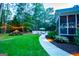 Lush backyard featuring a charming picnic area adorned with string lights, perfect for outdoor gatherings at 7003 Tara Dr, Villa Rica, GA 30180