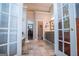 Large primary bathroom with double doors, walk in closet, and tub at 7003 Tara Dr, Villa Rica, GA 30180